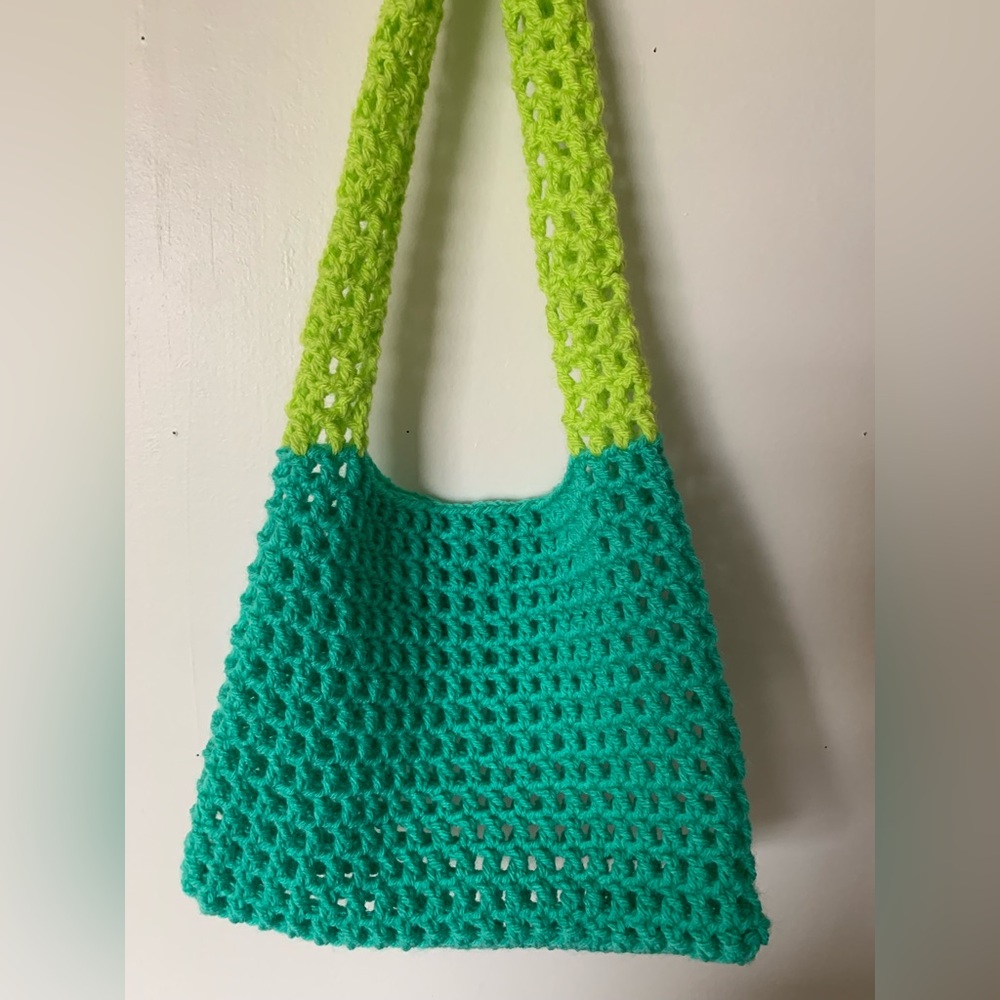 Handmade crochet small mesh style purse.